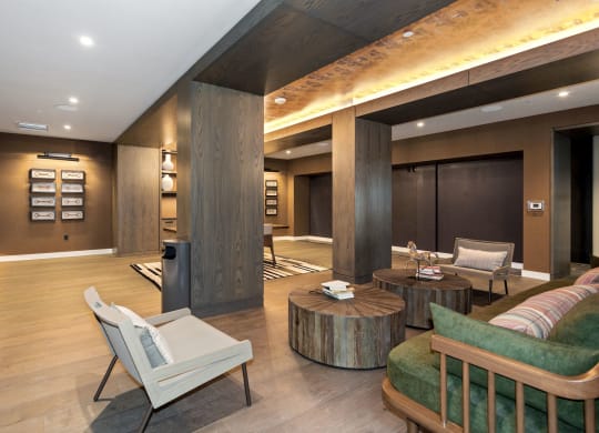 a large living room with wood floors and a fireplace at Vyne One Loudoun, Virginia