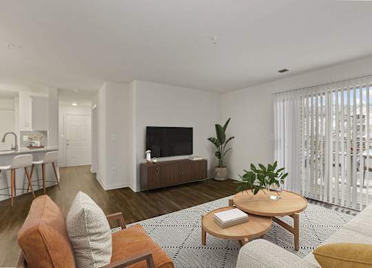 Living room with balcony at The Fields of Manassas