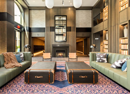 a lobby with couches and a fireplace at Vyne One Loudoun, Virginia