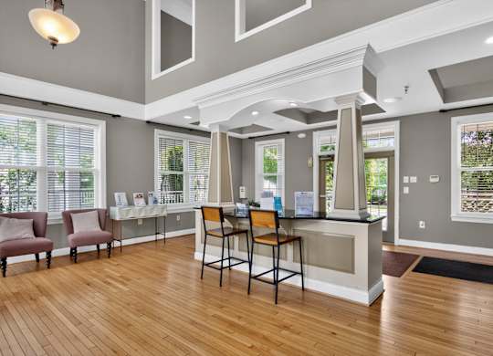 A reception area with a desk and chairs.