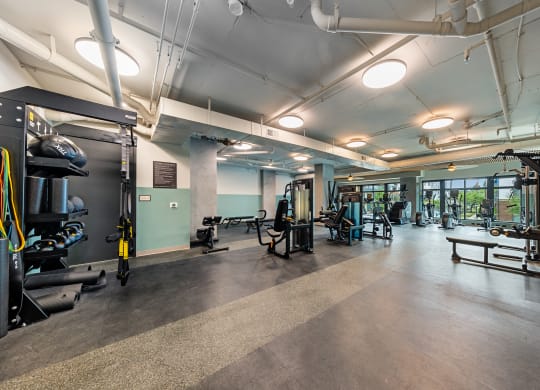 a gym with weights and other exercise equipment in a building at Hawkins Press, Charlotte, North Carolina