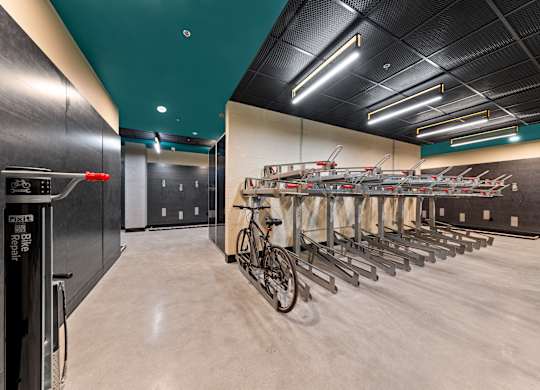 A bike repair shop with a row of bikes on the wall at Hawkins Press Apartments, North Carolina