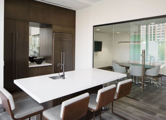 a conference room with a white table and chairs at 1305 Dock Street, Baltimore