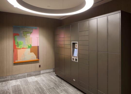 the elevators in the middle of a room with a painting on the wall at 1305 Dock Street, Baltimore, MD