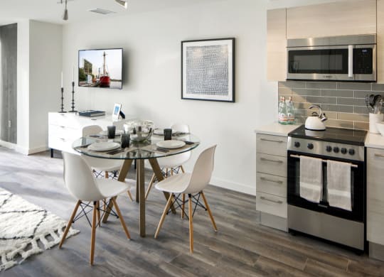 a kitchen and dining room with a table and chairs at 1305 Dock Street, Baltimore, MD