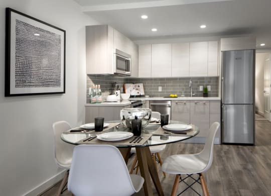 a kitchen and dining room with a table and chairs at 1305 Dock Street, Maryland