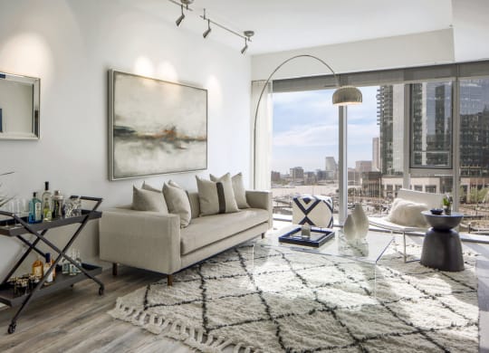 a living room with a couch and a view of the city at 1305 Dock Street, Baltimore