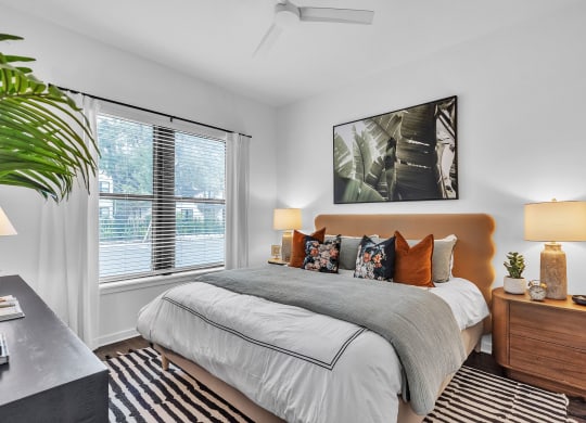 a bedroom with a bed and a large window  at La Unión, Florida
