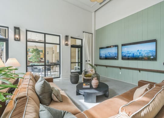 a living room with a couch and a coffee table and a television  at La Unión, Tampa, FL, 33605