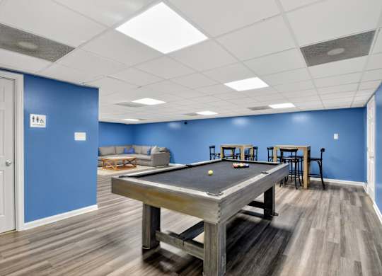 A pool table in a room with blue walls at Avondale Overlook, Hyattsville, 20782