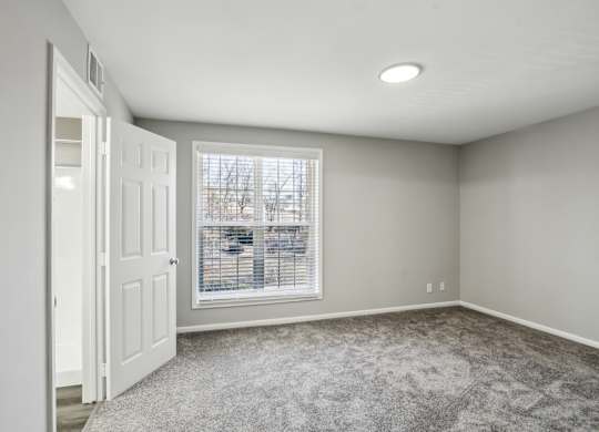A room with a window and a door at Shenandoah Station Apartments, Virginia 22172