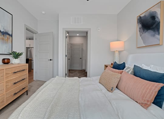 a bedroom with a large bed and a closet at Preston Ridge, Cary, NC