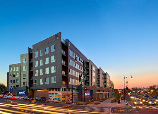 a large building on a city street at dusk at Fort Totten Square, Washington DC