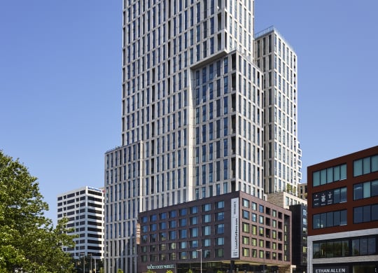 a cityscape with tall buildings and a street in the foreground at The Boro, Virginia, 22102