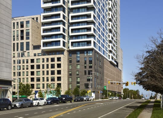 a tall building with many balconies and a blue sky in the background at The Boro, Virginia