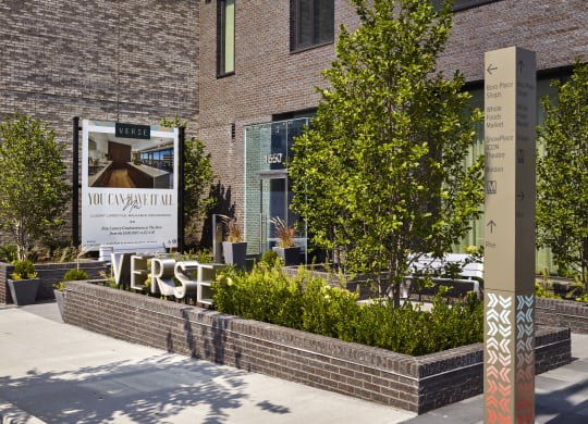 a large sign in front of a brick building at The Boro, Tysons