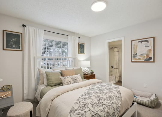 a bedroom with a large bed and a window at St. Andrews Reserve, North Carolina, 28412