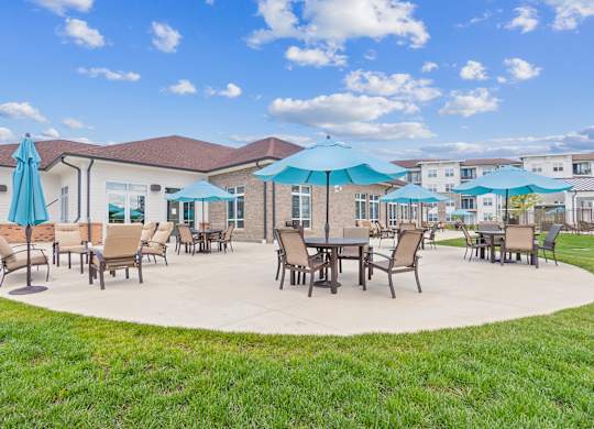 A sunny day at the outdoor seating area of a building.