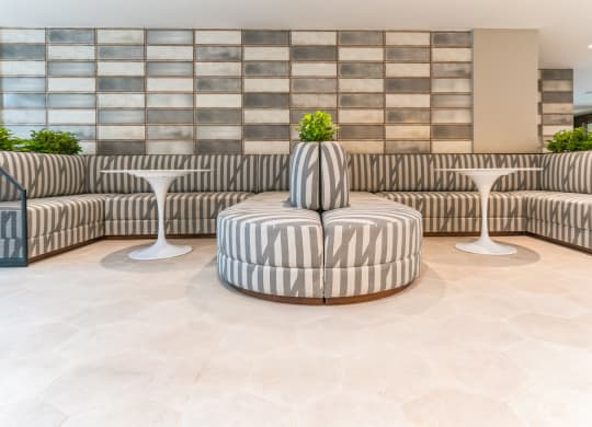 the lobby of a hotel with couches and tables at Hawkins Press, Charlotte, North Carolina