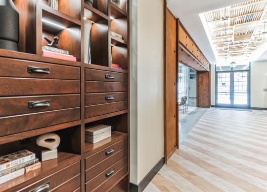 a closet with wooden drawers and a wood floor at Hawkins Press, North Carolina, 28203