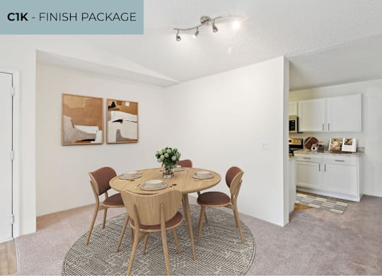 A dining room with a round table set for four.