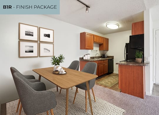A kitchen with a dining table and chairs.