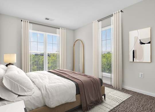 A bedroom with a large bed and a painting on the wall.