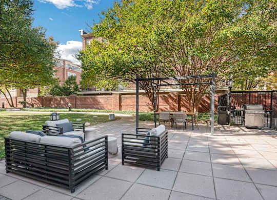 A park with benches and trees.