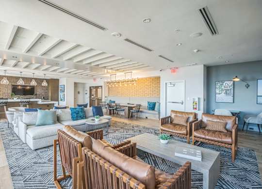 A spacious living room with a variety of seating options and a fireplace.