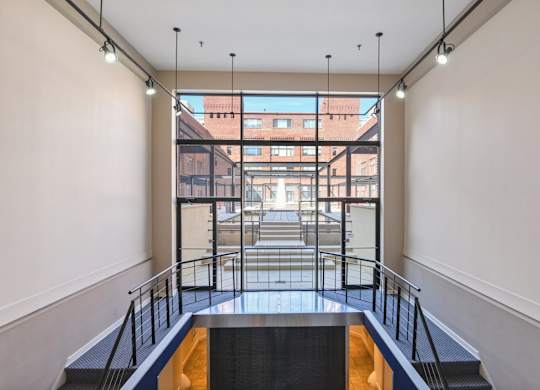 A view from the inside of a building looking out onto a city street.