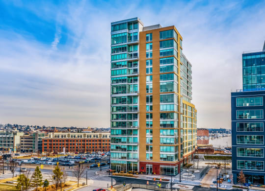 an aerial view of an office building with a city in the background at 1405 Point Street Apartments in Baltimore, MD