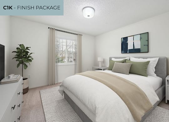 A bedroom with a large bed and a television.