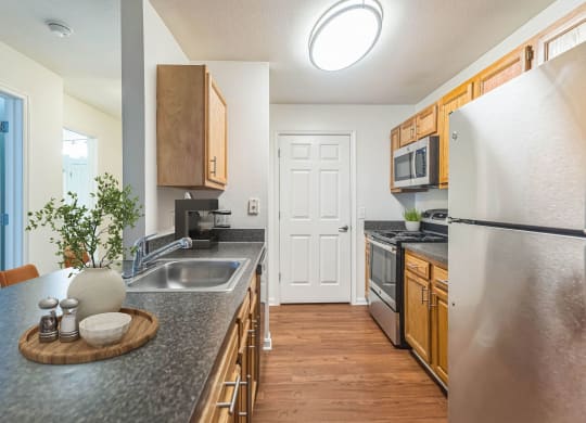 a kitchen with stainless steel appliances and granite counter tops at Sanger Place, Virginia, 22079