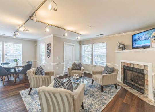 a living room with a fireplace and a table and chairs at Sanger Place, Virginia, 22079