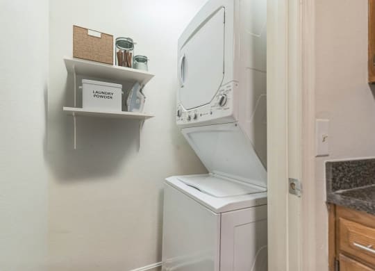 the washer and dryer in the laundry room of a small home at Sanger Place, Lorton, 22079
