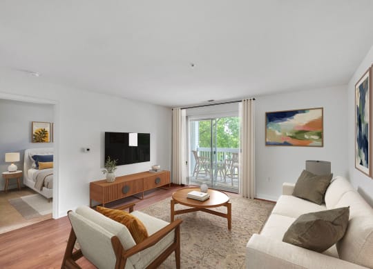 a living room with a couch and a tv and a sliding glass door at Sanger Place, Lorton, VA