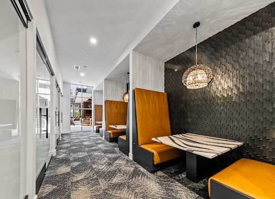 a long corridor with benches and tables in a lobby  at South and Hollis, Charlotte, 28209
