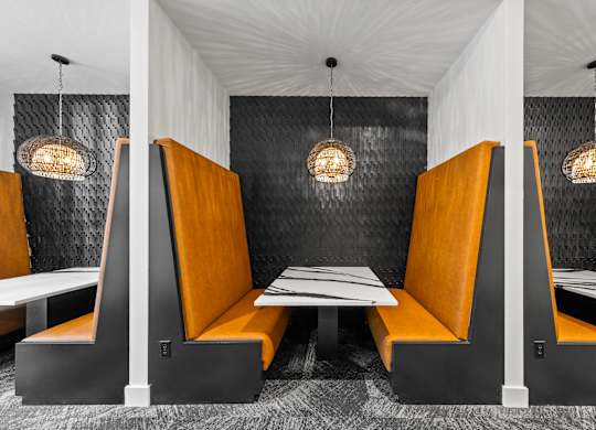 a dining room with orange booths and tables  at South and Hollis, North Carolina