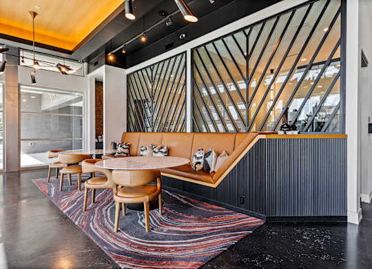 a dining room with a table and chairs and a staircase  at South and Hollis, North Carolina