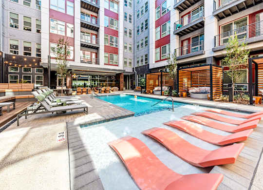 a swimming pool in the middle of an apartment building