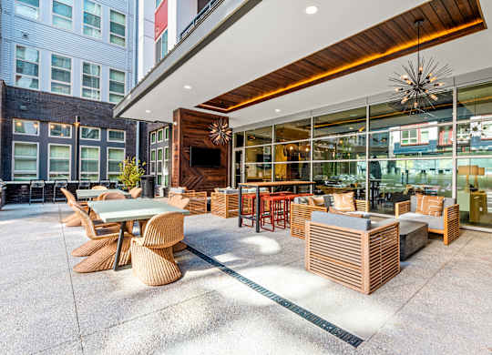 a patio with tables and chairs outside of a restaurant
