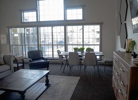 A living room with a couch, chairs, and a table at Arrowhead Ridge Apartments, Rio Rancho, NM, 87124