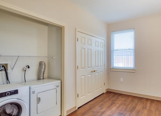 a laundry room with a washer and dryer and a window at North Market South Carroll, Frederick, MD