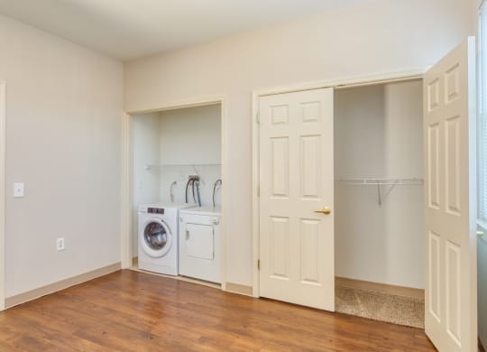a room with a washing machine and a door to a laundry room at North Market South Carroll, Frederick Maryland
