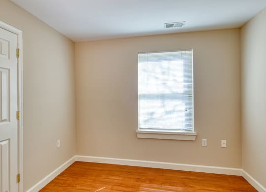 an empty room with a white door and a window at North Market South Carroll, Frederick, MD 21701