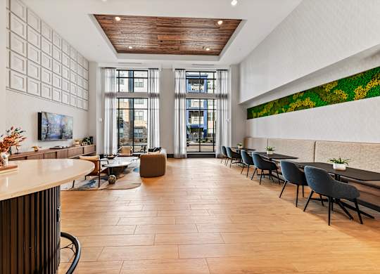 Clubhouse lounge and coworking space with couch and booths. Preston Ridge Cary, NC.