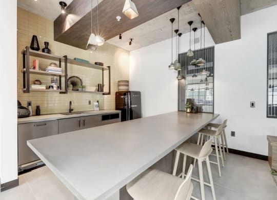 a kitchen with a long counter top and a long table at Reed Row, Washington, Washington DC