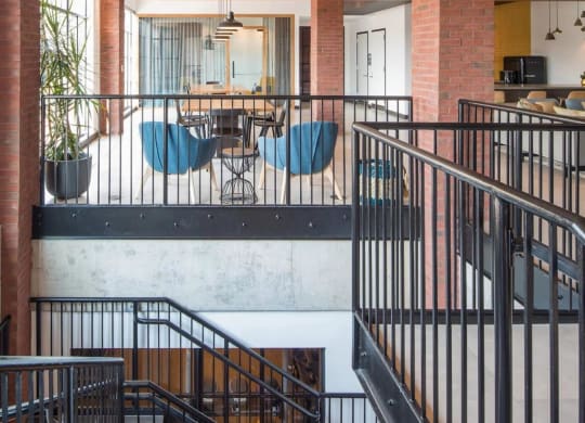 the interior of a building with stairs and a dining room at Reed Row, Washington, DC
