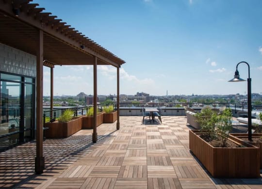 a roof terrace with a view of the city at Reed Row, Washington, 20009