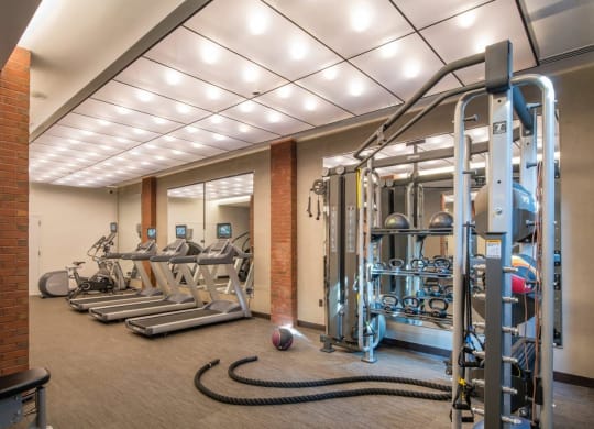 a gym with weights and cardio equipment in a building at Reed Row, Washington, 20009